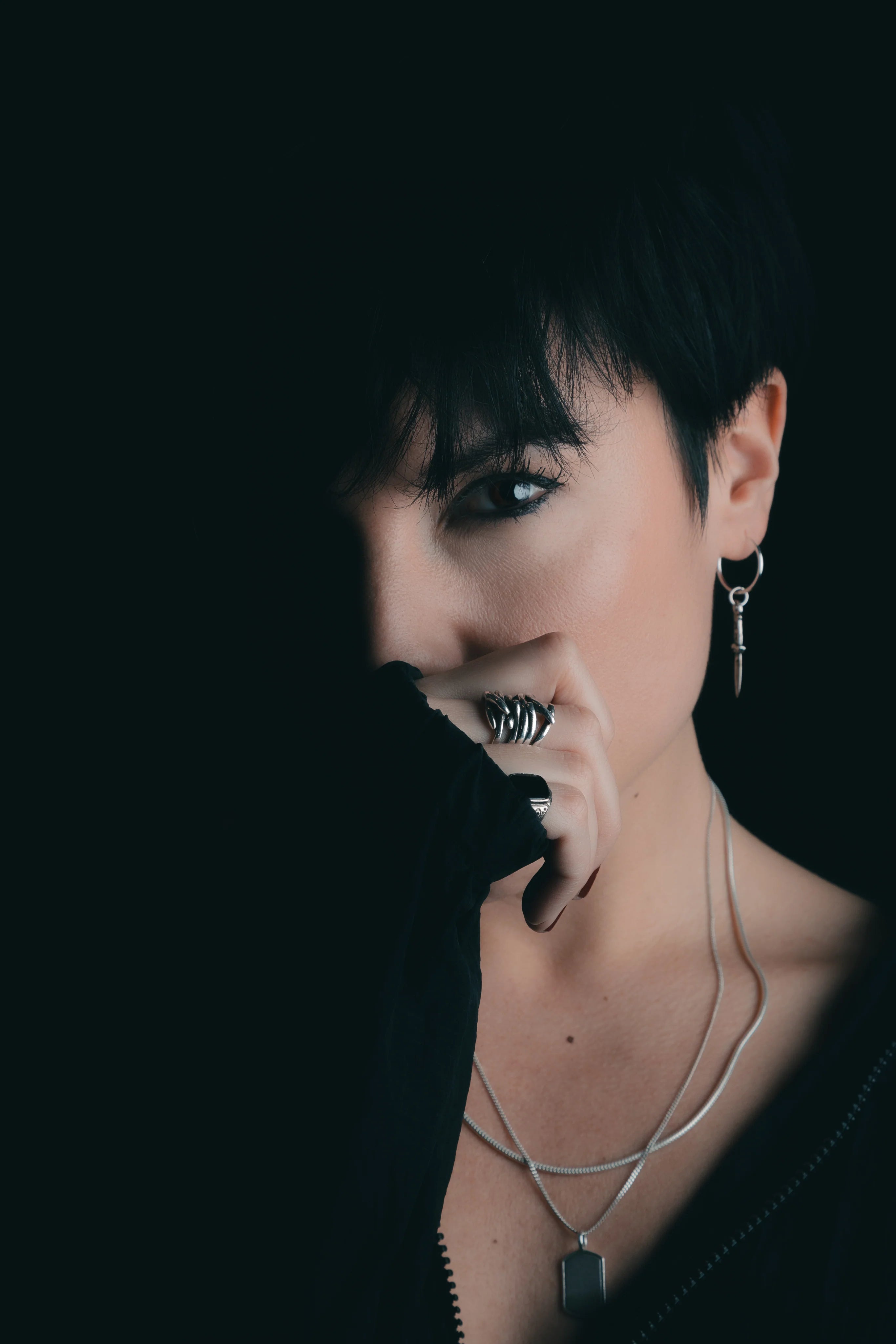 files/woman-holds-hand-over-bottom-half-of-her-face_e0a3cdc9-c9a2-4566-afbd-a9643180c27d.webp